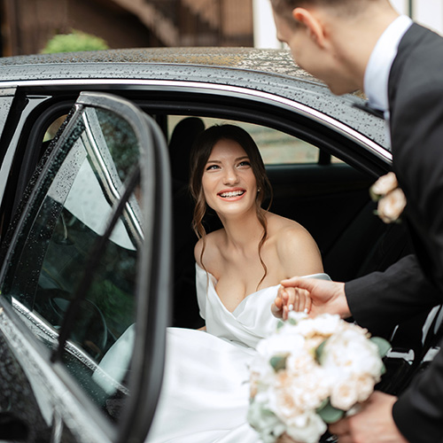 A couple enjoys their wedding limo service in luxury.